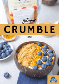 A bowl of biscuit crumble topped with blueberries and a drizzle of sauce, with text overlay 'get your CRUMBLE on!