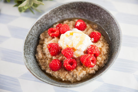 A steaming bowl of traditional oat porridge, ready for World Porridge Day